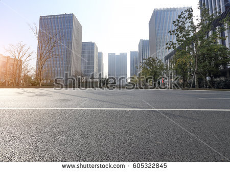 city road through modern buil